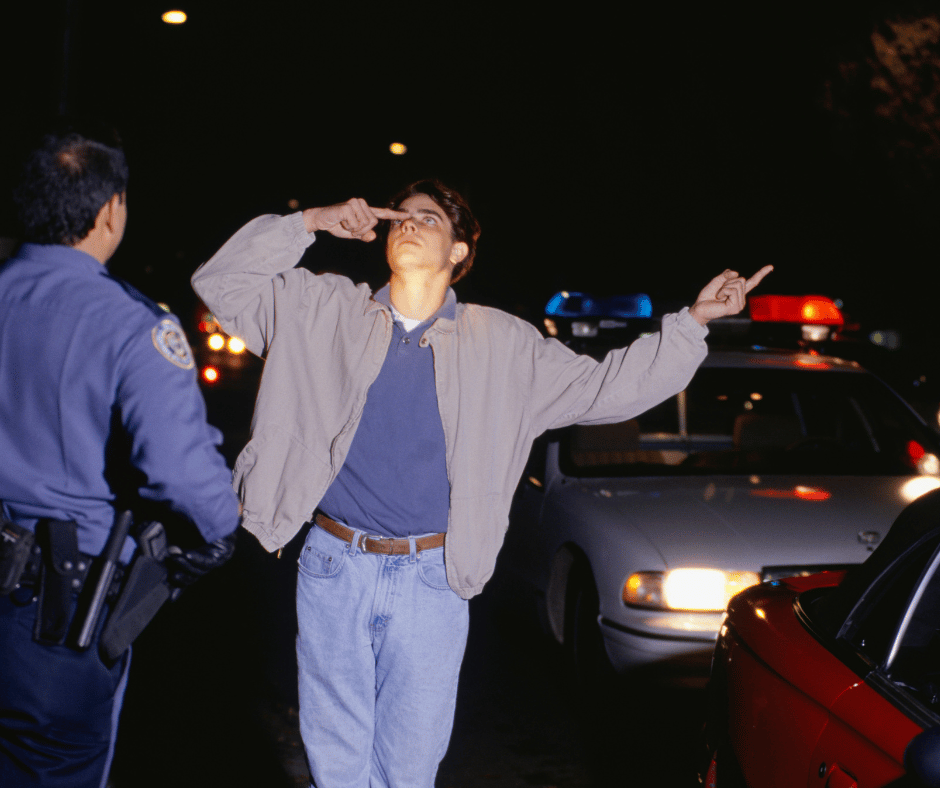 Man performing field sobriety test after being stopped by law enforcement